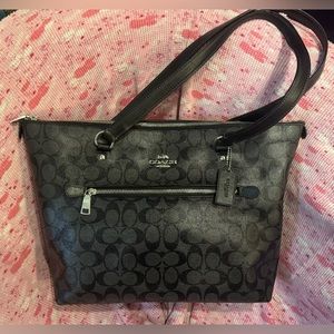 Big like new Coach bag. Dark grey with black C’s lots of room